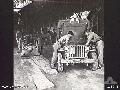 BALIKPAPAN, BORNEO. 1945-09-04. TRANSPORT DRIVERS OF 10TH FIELD AMBULANCE CARRYING OUT MAINTENANCE ON AN AMBULANCE JEEP AND TRAILER.