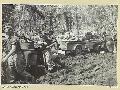 BOUGAINVILLE. 1945-04-26. PERSONNEL OF 24 INFANTRY BATTALION, LOADING BARBED WIRE, AMMUNITION, AND SUPPLIES ON TO A JEEP TRAILER