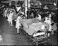 Female employees work on an assembly line at the former Willys-Overland Motors plant on Dec. 2, 1941