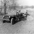 Four wheel steering jeep uder testing. Ford GP, Willys MBs. Baltimore, Maryland, USA, February 1942.