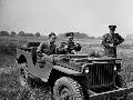 20118239-S Ford GPW, With Edsel Ford as a passenger, King Peter II of Yugoslavia drove an Army Jeep over the rough sand wastes at the Ford Motor Company proving grounds in Detroit, July 1, 1942.