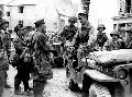 20489453-S Willys MB, General von Auloch salutes his officers and men after the Germans surrender at St. Malo, Brittany, 17 August 1944.