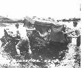 1943 Cape Gloucester marines pushing jeep out of flood