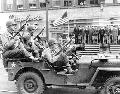2062247 GPW Soldiers ride in a jeep during a War Bond parade, Fort Douglas, Utah, 1942.