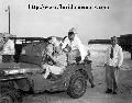 20583068 Ford GPW, Saxton Lloyd, James Larimore and members of the military near a jeep - Eglin Air Force Base, Florida