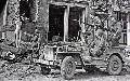 20493763-S MB, GI 's in a jeep observe a mannequin in a bombed out city. Germany, 1945. Via - G. Almeida