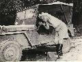 20238558 s MB 1943- Brig. Gen. Haydon Boatner shaving in the rear view mirror of a Jeep while on a tour of the front in Burma. AP photo