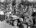20520232-S GPW Czech civilians crowd around a U.S. Army jeep as American troops are welcomed into the liberated. 1945