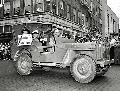 20111741 s GPW Hero Parade. Squadron Leader John Daring Nettleton and Ensign Donald F. Mason, in Jeep. 1942. Forth Worth Star-Telegram Collection
